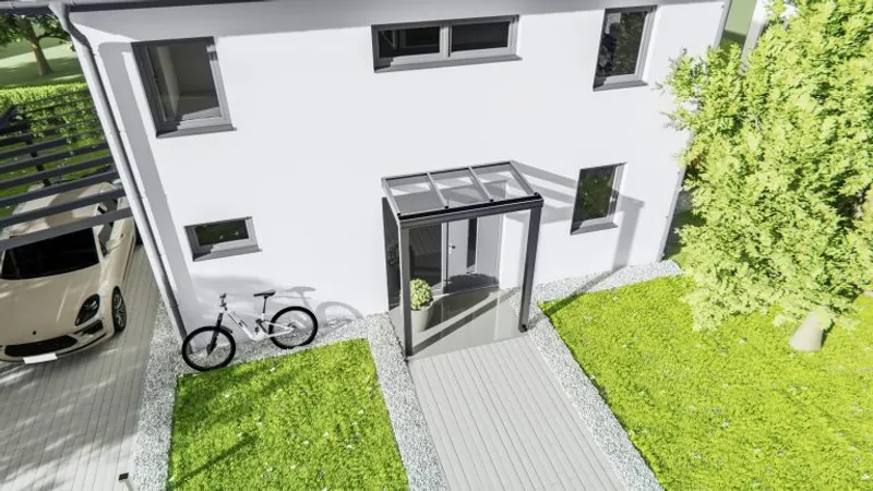 Eingangsüberdachung mit Glasseitenteil an einem Einfamilienhaus